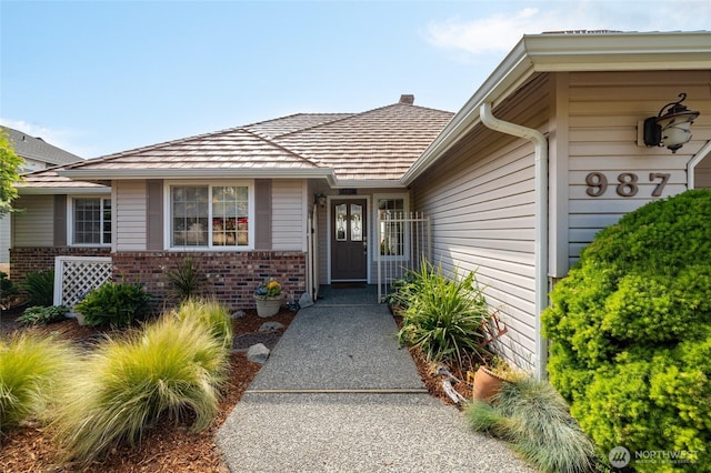 987 NW Camano Dr, Camano Island, WA 98282 - view of exterior entry with brick siding