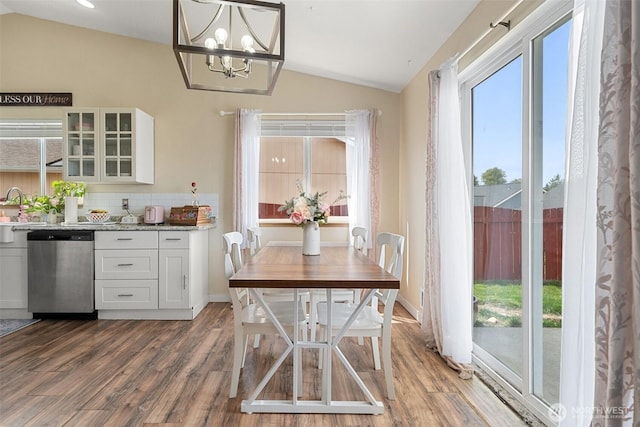 61 Patriot Way, Sequim, WA 98382 - dining space with lofted ceiling, wood finished floors, and a chandelier