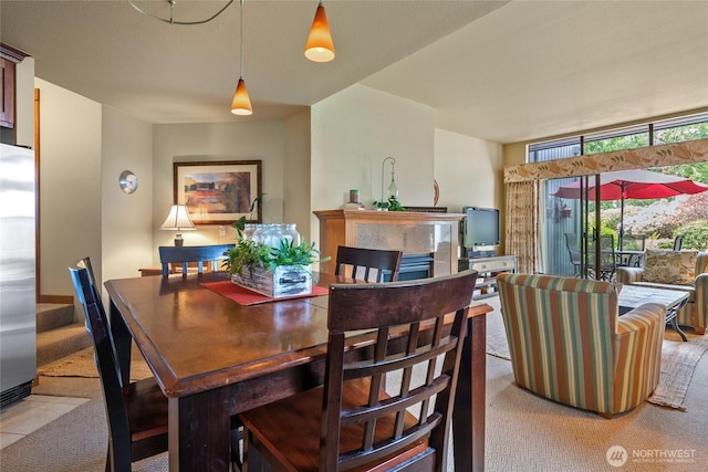 7806 Birch Bay Dr Unit 515, Blaine, WA 98230 - dining space featuring light carpet and a fireplace