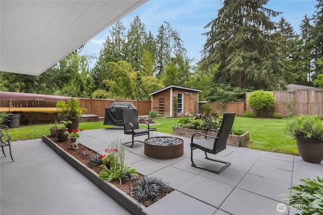 view of patio with an outbuilding