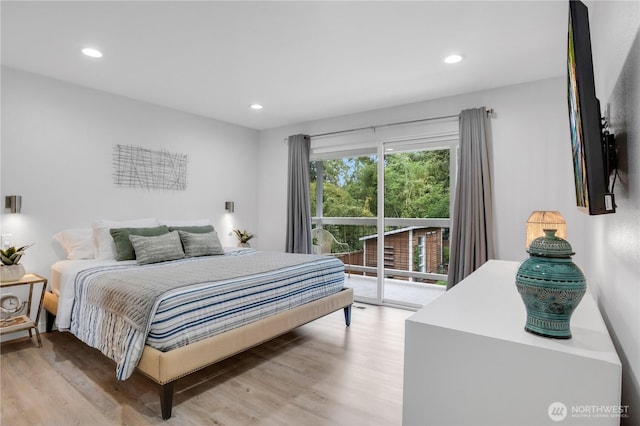 bedroom featuring access to exterior, light wood-style flooring, and recessed lighting