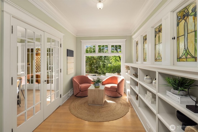 sunroom / solarium featuring french doors