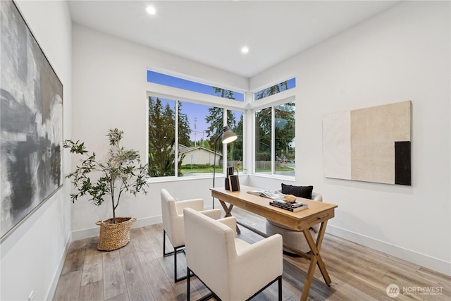 home office featuring wood finished floors, recessed lighting, and baseboards