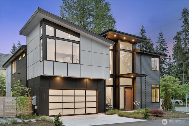 13220 NE 70th St, Redmond, WA 98052 - contemporary house featuring an attached garage and driveway