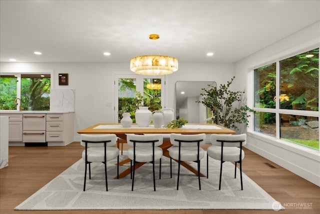 12914 43rd Ave Court NW, Gig Harbor, WA 98332 - dining space with wood finished floors, recessed lighting, and plenty of natural light