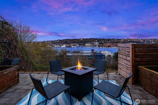 1416 6th Ave N, Seattle, WA 98109 - view of patio featuring an outdoor fire pit and a water view