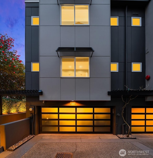 1416 6th Ave N, Seattle, WA 98109 - view of front of house featuring a garage and stucco siding
