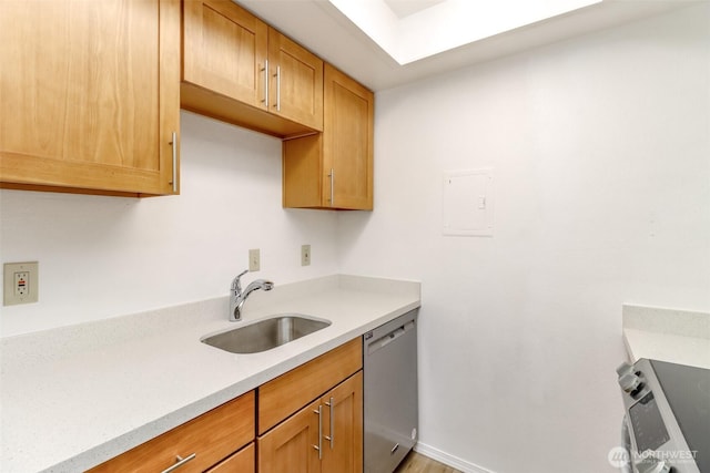 14650 NE 32nd St Unit A-13, Bellevue, WA 98007 - kitchen featuring stainless steel dishwasher, a sink, light countertops, stove, and baseboards