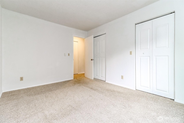 14650 NE 32nd St Unit A-13, Bellevue, WA 98007 - unfurnished bedroom with carpet floors and baseboards
