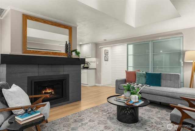 18906 32nd Ave NE, Lake Forest Park, WA 98155 - living area featuring light wood-style floors and a tiled fireplace