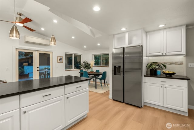 18906 32nd Ave NE, Lake Forest Park, WA 98155 - kitchen with stainless steel refrigerator with ice dispenser, an AC wall unit, light wood-type flooring, decorative backsplash, and white cabinets