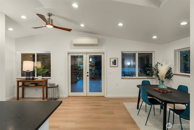 18906 32nd Ave NE, Lake Forest Park, WA 98155 - dining space with a wall mounted AC, lofted ceiling, french doors, light wood finished floors, and ceiling fan