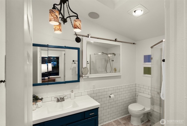 18906 32nd Ave NE, Lake Forest Park, WA 98155 - full bathroom featuring tile walls, a stall shower, toilet, vanity, and wainscoting