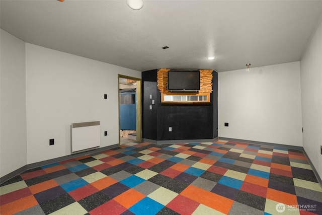 18906 32nd Ave NE, Lake Forest Park, WA 98155 - unfurnished living room featuring radiator, recessed lighting, and baseboards