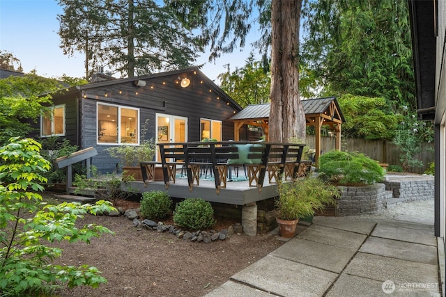 18906 32nd Ave NE, Lake Forest Park, WA 98155 - back of house featuring a gazebo, a deck, a standing seam roof, fence, and metal roof