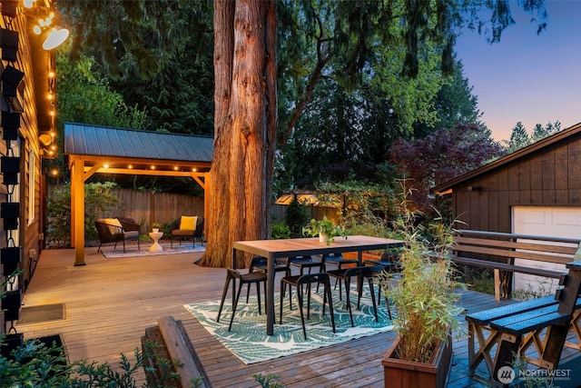 18906 32nd Ave NE, Lake Forest Park, WA 98155 - deck at dusk with outdoor dining space and a gazebo