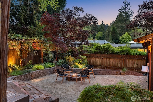 18906 32nd Ave NE, Lake Forest Park, WA 98155 - view of patio featuring a fenced backyard and a fire pit