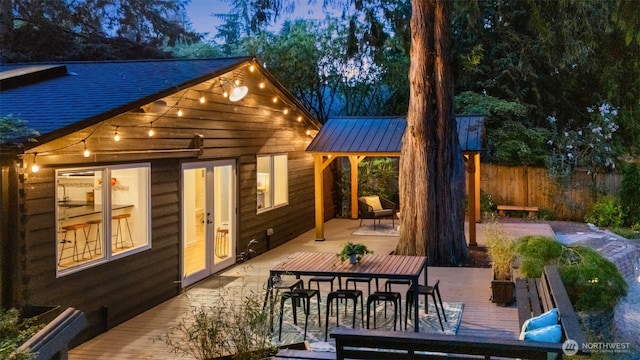 18906 32nd Ave NE, Lake Forest Park, WA 98155 - back of property featuring fence, a standing seam roof, a deck, and french doors
