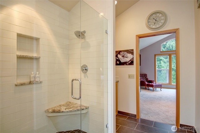 37938 Theo Ln, Concrete, WA 98237 - full bathroom featuring lofted ceiling, a shower stall, tile patterned floors, and baseboards