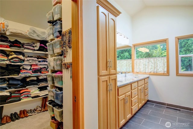 37938 Theo Ln, Concrete, WA 98237 - bathroom with vaulted ceiling, tile patterned flooring, and vanity