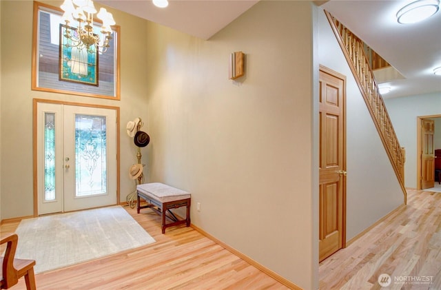 37938 Theo Ln, Concrete, WA 98237 - entrance foyer featuring light wood-type flooring, a chandelier, stairs, and baseboards