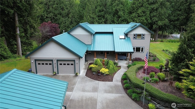 37938 Theo Ln, Concrete, WA 98237 - view of front of house with covered porch, driveway, metal roof, a front lawn, and a garage