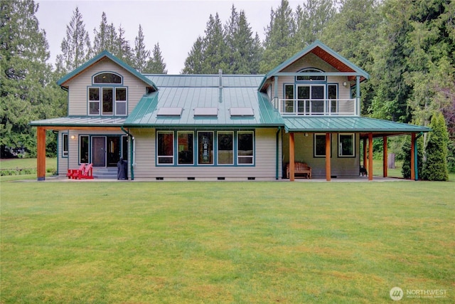 37938 Theo Ln, Concrete, WA 98237 - rear view of house with a standing seam roof, a porch, and a lawn