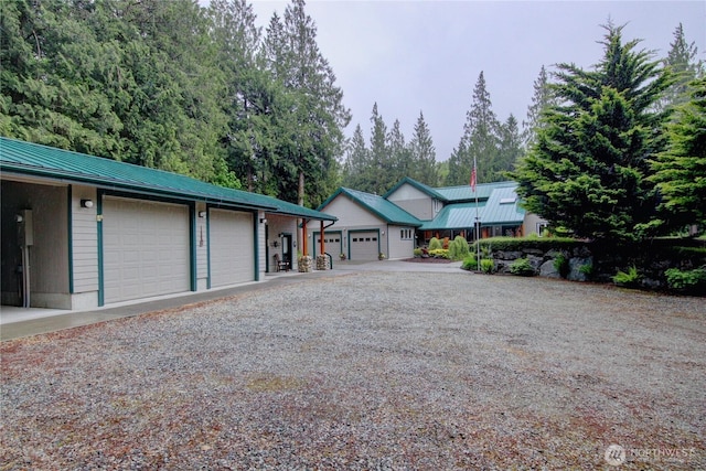37938 Theo Ln, Concrete, WA 98237 - view of front of home with a detached garage and metal roof