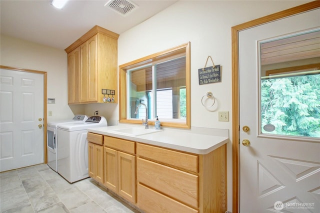 37938 Theo Ln, Concrete, WA 98237 - laundry area with cabinet space, washing machine and dryer, and healthy amount of natural light