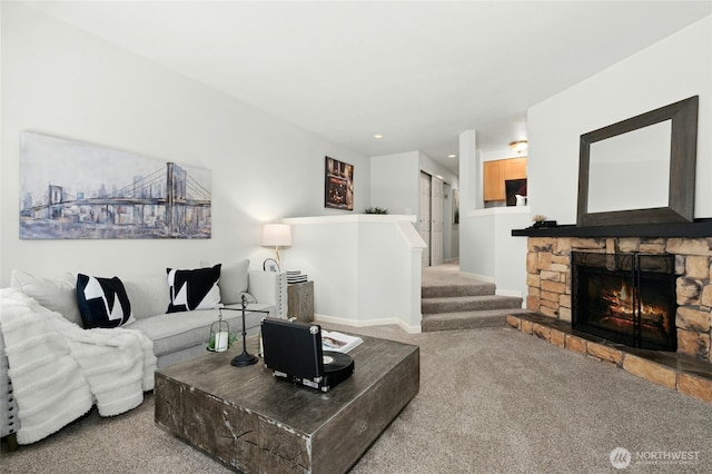 12044 96th Ave NE Unit 211, Kirkland, WA 98034 - carpeted living area with a stone fireplace, recessed lighting, stairway, and baseboards