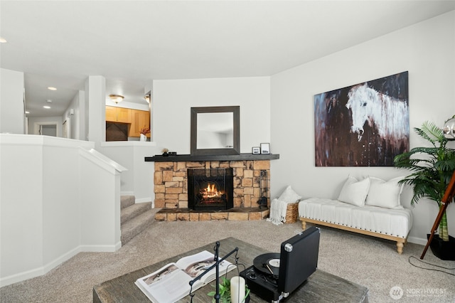 12044 96th Ave NE Unit 211, Kirkland, WA 98034 - living room with carpet flooring, a stone fireplace, stairway, baseboards, and recessed lighting