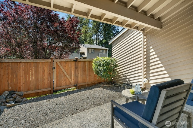 12044 96th Ave NE Unit 211, Kirkland, WA 98034 - view of patio / terrace with a gate