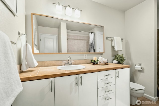 12513 NE 130th Way Unit C204, Kirkland, WA 98034 - bathroom with vanity, toilet, a shower with shower curtain, and baseboards