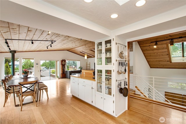 kitchen with rail lighting, wood ceiling, vaulted ceiling, recessed lighting, and light wood-style floors
