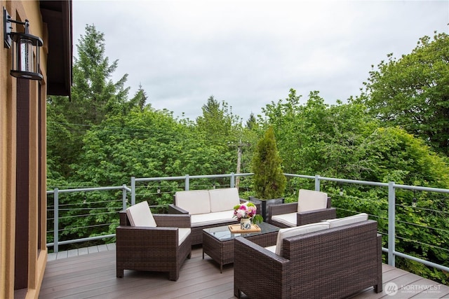 wooden deck featuring outdoor lounge area