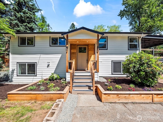 13517 Bingham Ave E, Tacoma, WA 98446 - view of front facade featuring a garden