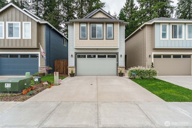 7135 S 13th St, Ridgefield, WA 98642 - view of front of property featuring a garage, stone siding, board and batten siding, and driveway