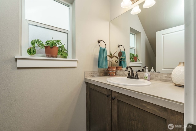 7135 S 13th St, Ridgefield, WA 98642 - bathroom featuring tasteful backsplash, vanity, and lofted ceiling