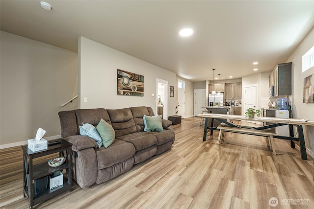 7135 S 13th St, Ridgefield, WA 98642 - living room featuring recessed lighting, light wood-style flooring, and baseboards