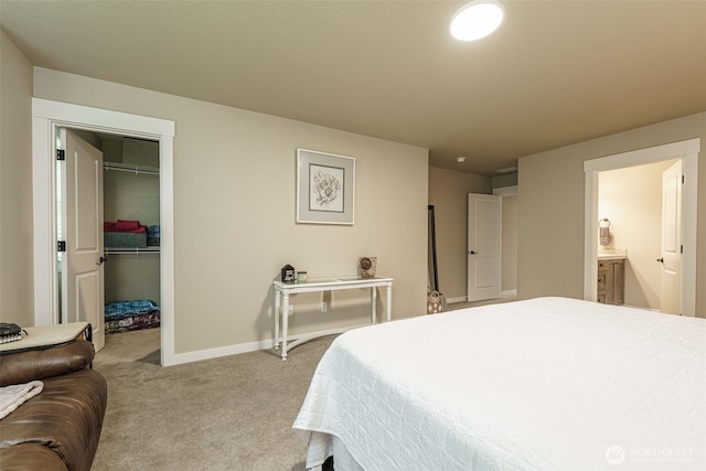 7135 S 13th St, Ridgefield, WA 98642 - bedroom featuring carpet flooring, a walk in closet, baseboards, ensuite bathroom, and a closet