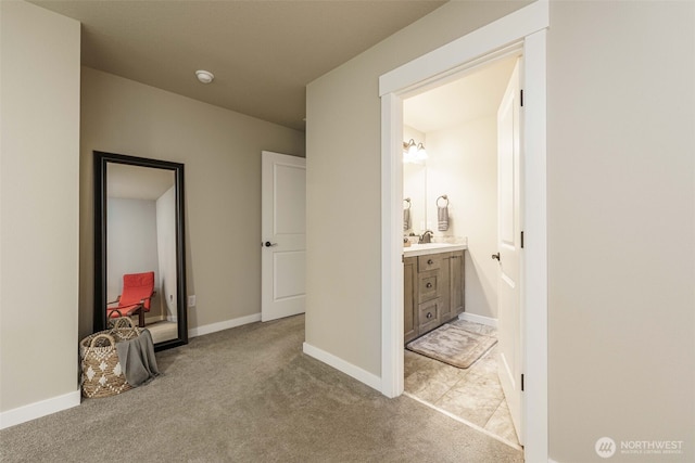 7135 S 13th St, Ridgefield, WA 98642 - hall featuring a sink, light carpet, and baseboards