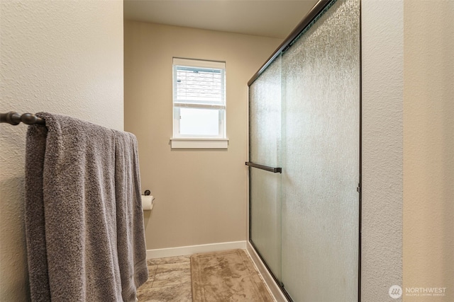 7135 S 13th St, Ridgefield, WA 98642 - full bathroom featuring a shower with shower door, baseboards, and tile patterned floors