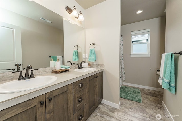 7135 S 13th St, Ridgefield, WA 98642 - bathroom featuring baseboards and double vanity