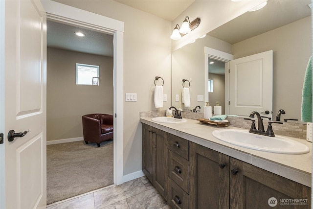 7135 S 13th St, Ridgefield, WA 98642 - bathroom with double vanity and baseboards