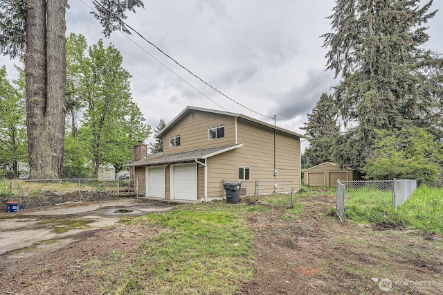 21502 38th Ave E, Spanaway, WA 98387 - view of home's exterior with fence and a chimney