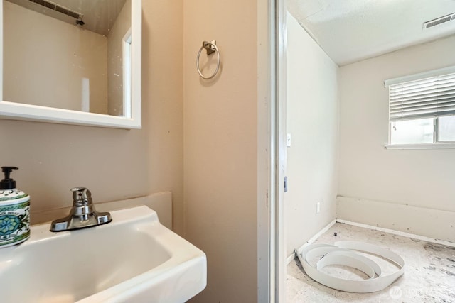 21502 38th Ave E, Spanaway, WA 98387 - bathroom with a sink and baseboards