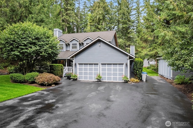 19432 SE 342nd St, Auburn, WA 98092 - view of front of home featuring a garage, a chimney, and driveway