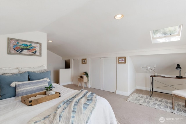7610 E Grapeview Loop Rd, Allyn, WA 98524 - bedroom featuring a skylight, vaulted ceiling, light carpet, baseboards, and recessed lighting