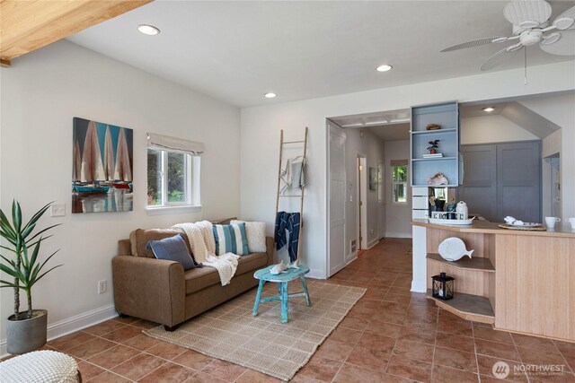 7610 E Grapeview Loop Rd, Allyn, WA 98524 - tiled living room with healthy amount of natural light, recessed lighting, ceiling fan, and baseboards