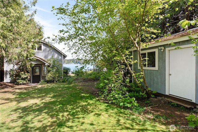 7610 E Grapeview Loop Rd, Allyn, WA 98524 - view of green lawn with an outdoor structure